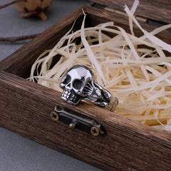 Hand Holding Skull Ring